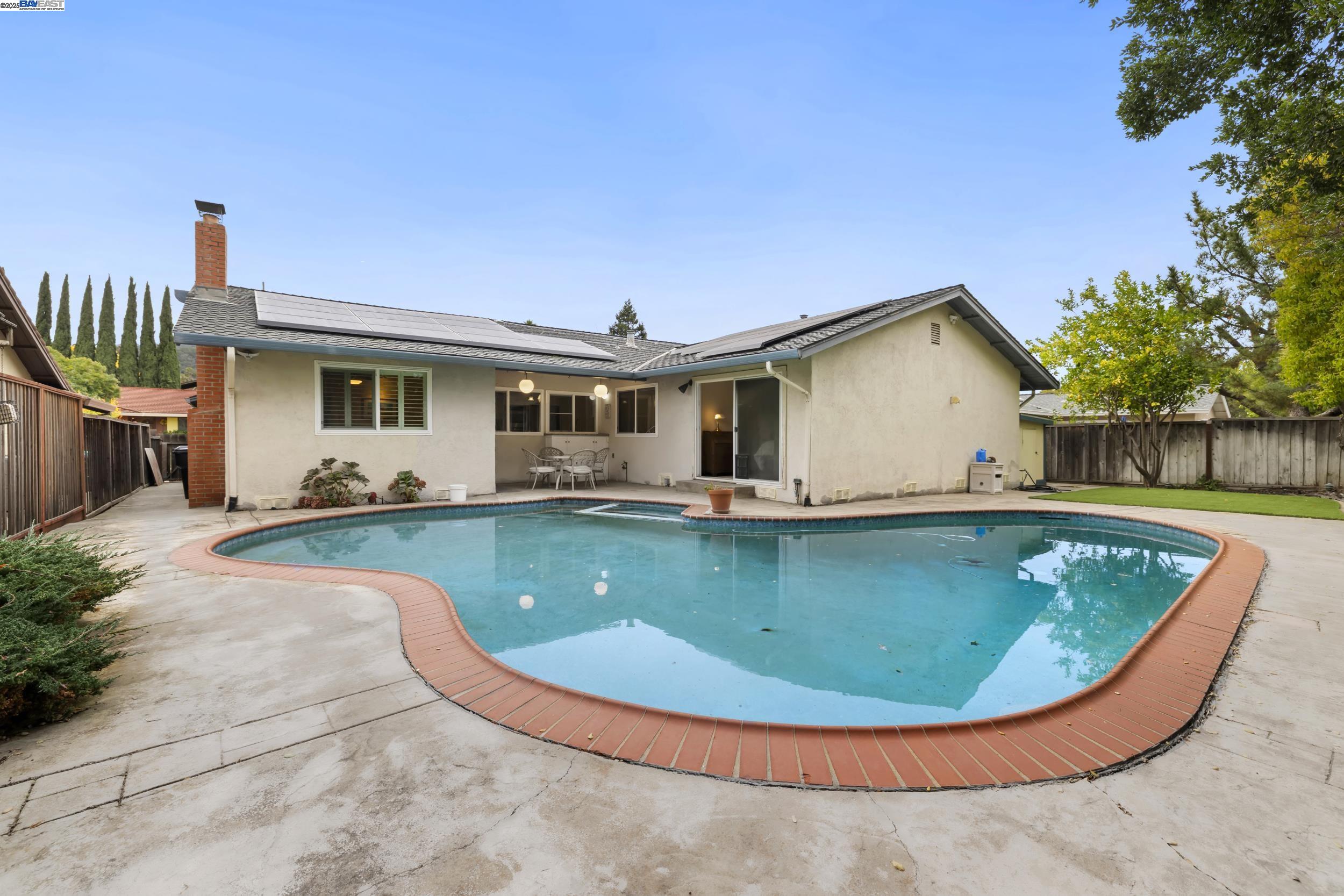 5145 Springdale Avenue Pleasanton, CA 94588 - Photo 35 of 51 a view of a house with swimming pool