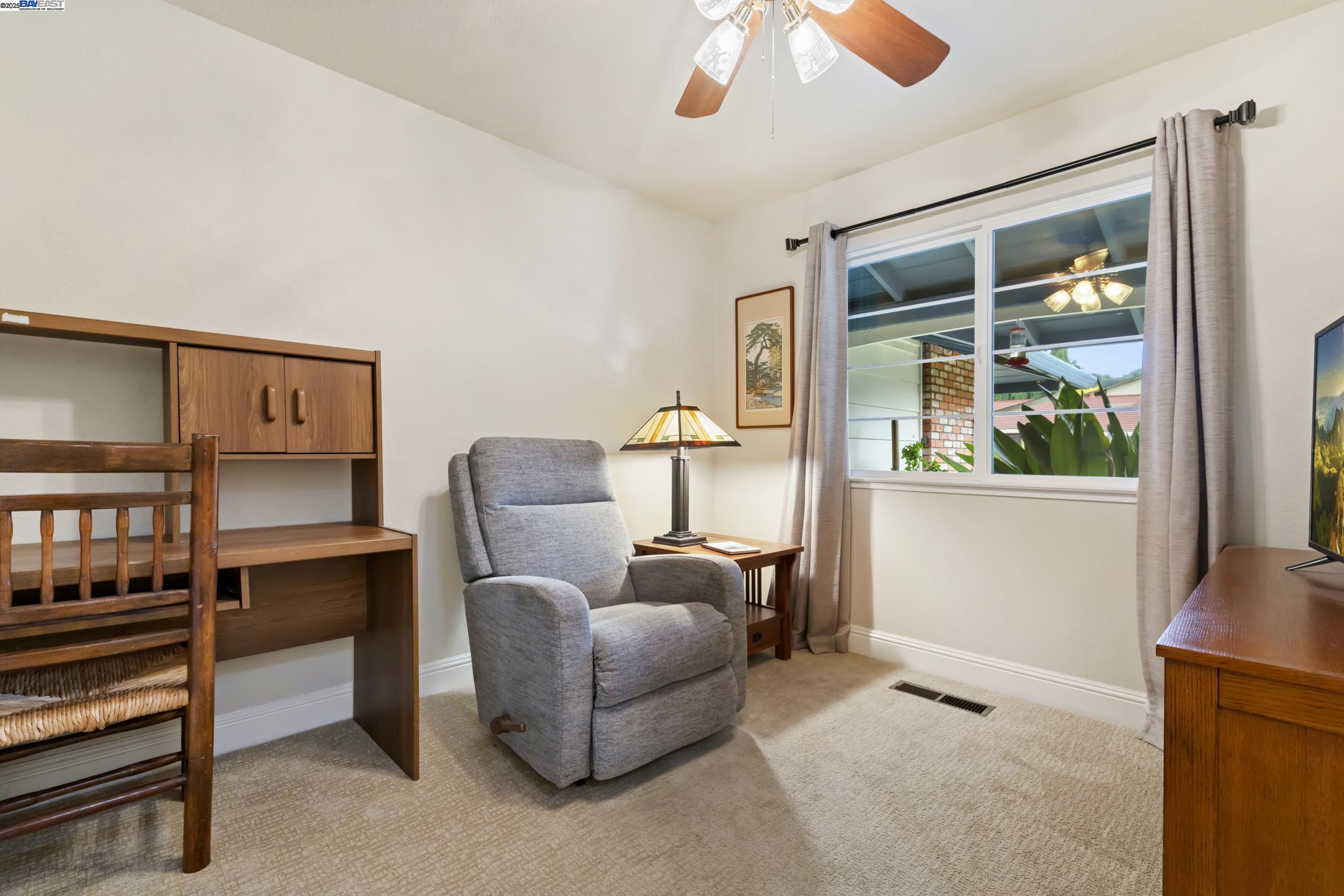 5145 Springdale Avenue Pleasanton, CA 94588 - Photo 6 of 51 a living room with furniture and a window