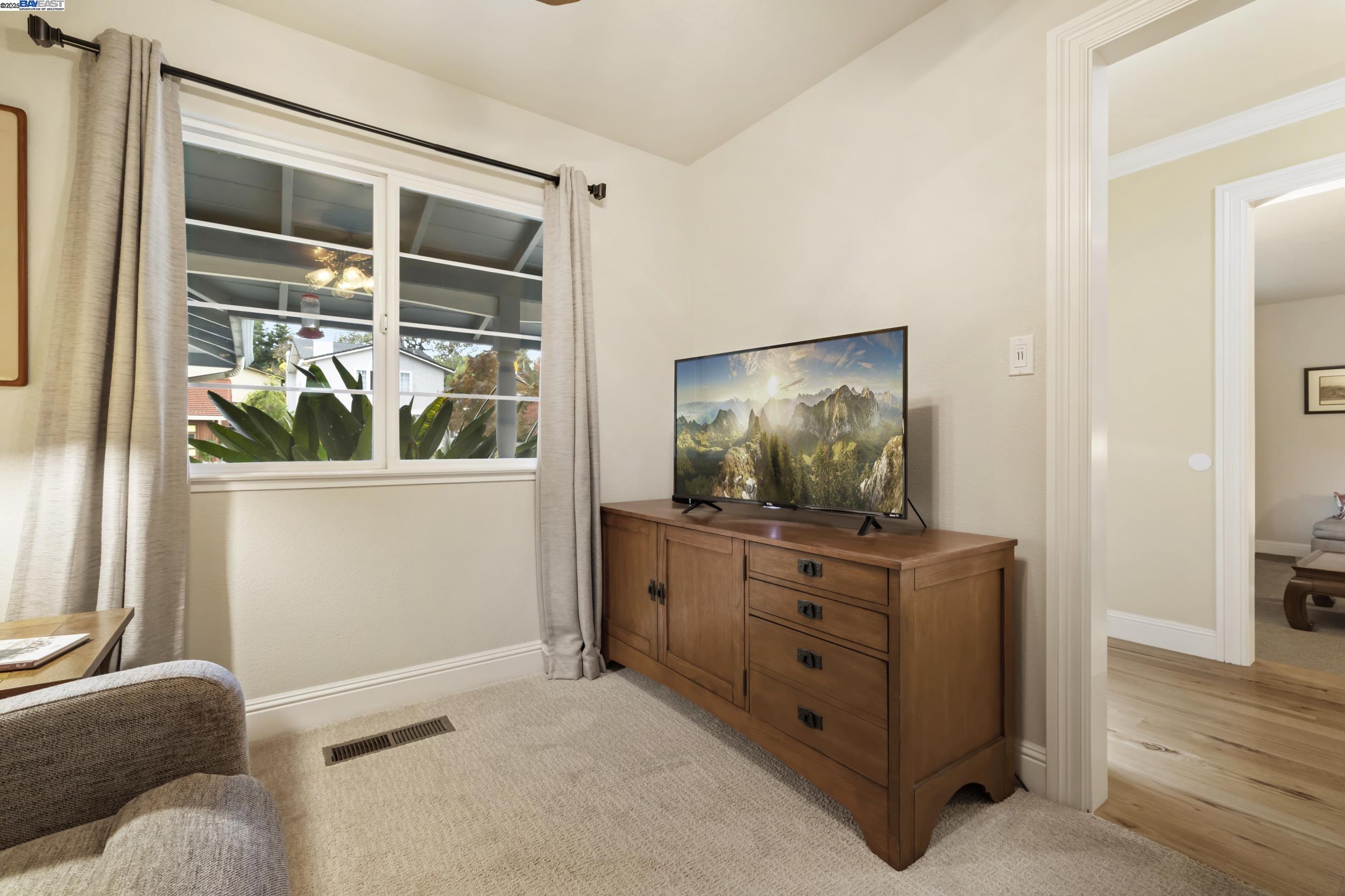 5145 Springdale Avenue Pleasanton, CA 94588 - Photo 7 of 51 a living room with furniture and a flat screen tv