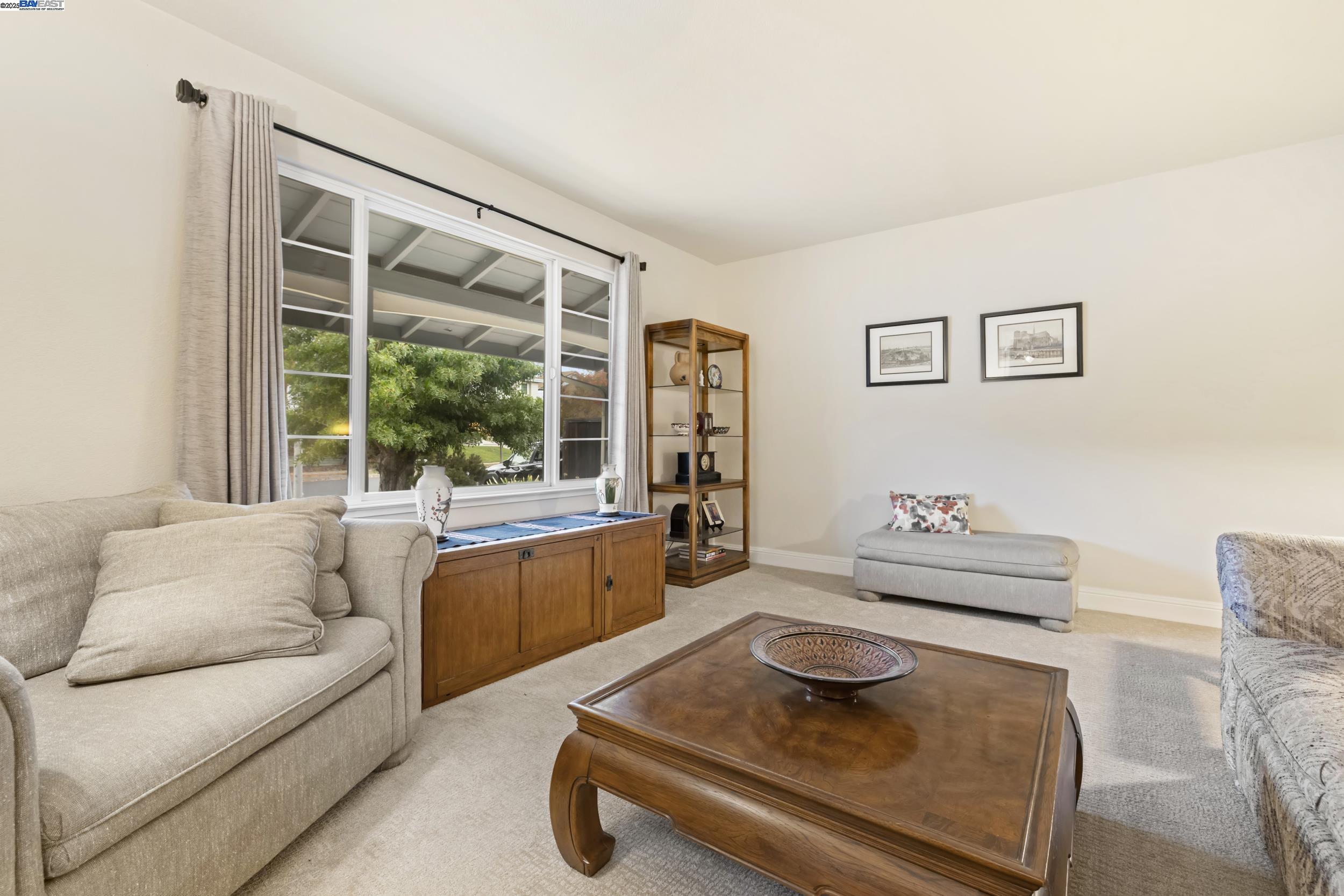 5145 Springdale Avenue Pleasanton, CA 94588 - Photo 8 of 51 a living room with furniture and a window