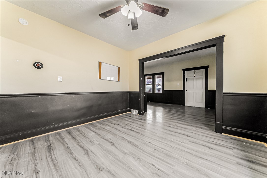 2014 Cook Avenue Cleveland, OH 44109 - Photo 7 of 37 Unfurnished room featuring ceiling fan and light wood-type flooring