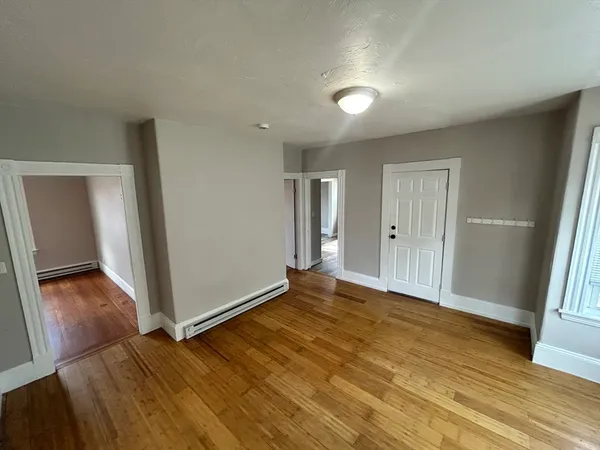 a view of entryway with wooden floor