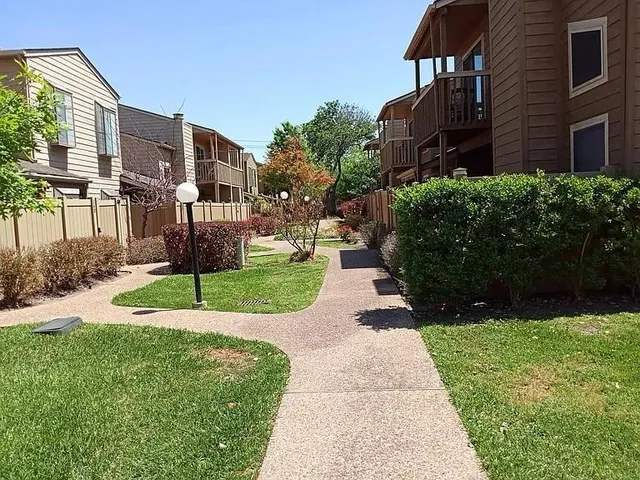 a view of a pathway both side of the house