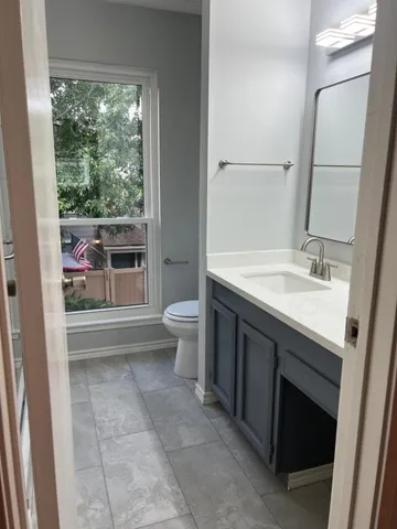 a bathroom with a sink a toilet and a bathtub