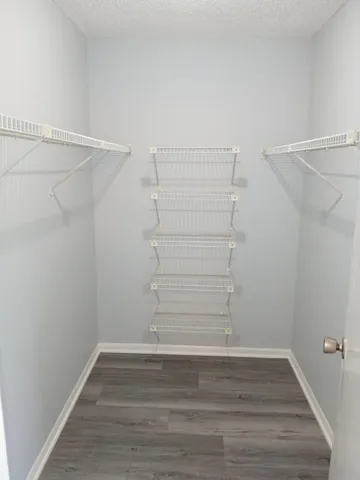 a view of an empty walk in closet