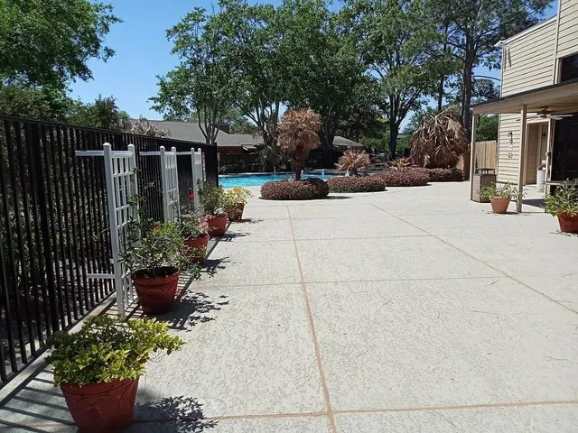 a view of a garden with sitting area