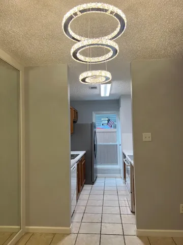 a kitchen with a refrigerator and stove