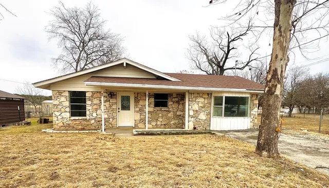 a front view of a house with a patio
