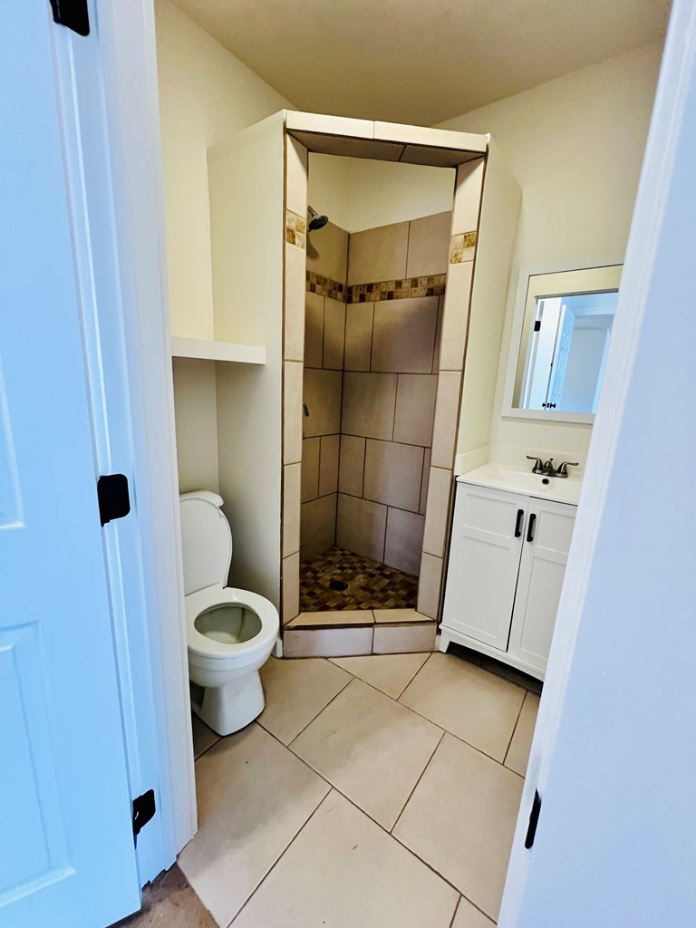 303 Meadow View Lane Kerrville, TX 78028 - Photo 7 of 12 a bathroom with a toilet and a shower