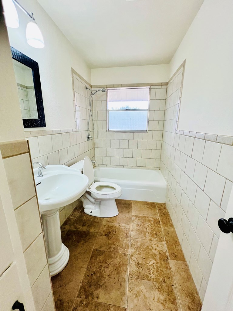 303 Meadow View Lane Kerrville, TX 78028 - Photo 8 of 12 a bathroom with a sink toilet and shower