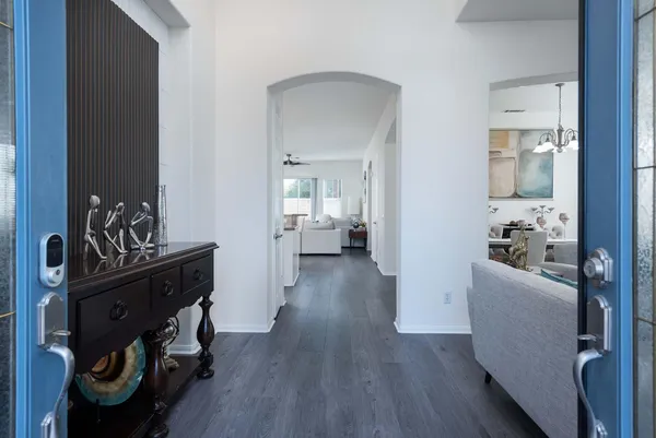 a kitchen with stainless steel appliances granite countertop a refrigerator stove and microwave