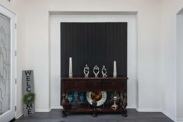 a bedroom with a bed a desk and chair