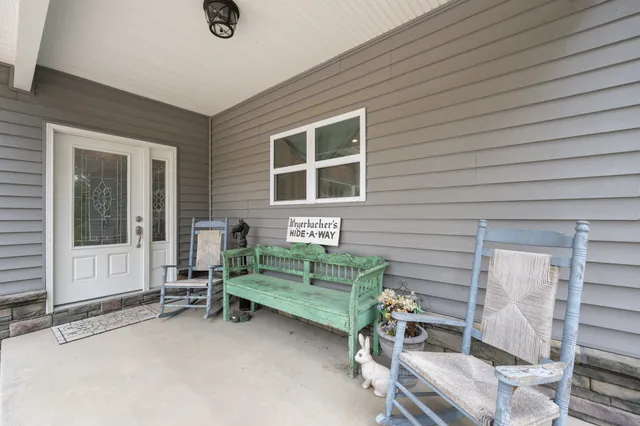 a backyard of a house with outdoor seating