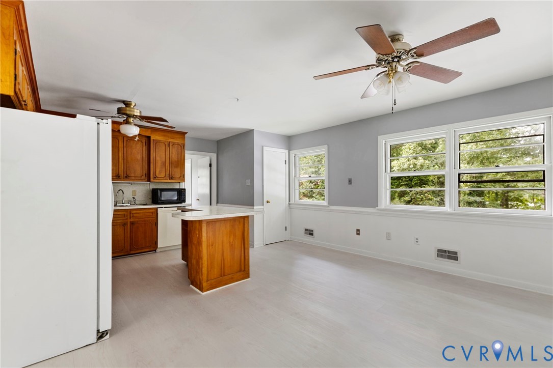 11709 Boyd Road Chester, VA 23831 - Photo 12 of 32 a kitchen with stainless steel appliances granite countertop a stove a sink and a refrigerator