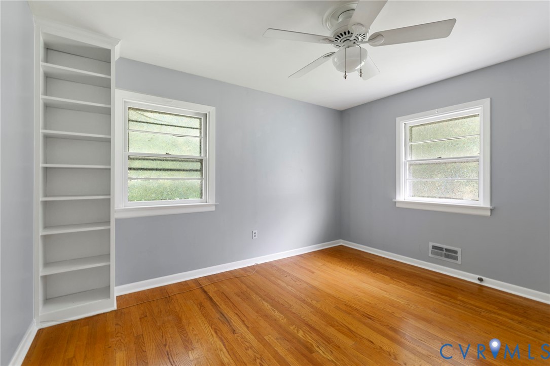 11709 Boyd Road Chester, VA 23831 - Photo 16 of 32 a view of empty room with window and ceiling fan