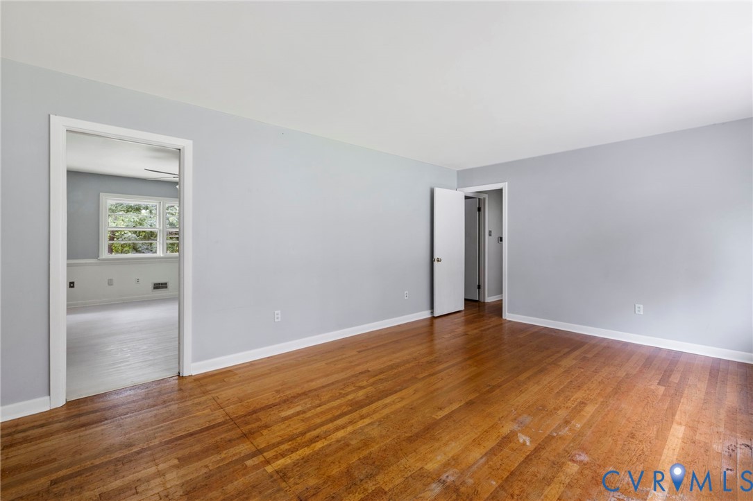 11709 Boyd Road Chester, VA 23831 - Photo 2 of 32 a view of an empty room and wooden floor