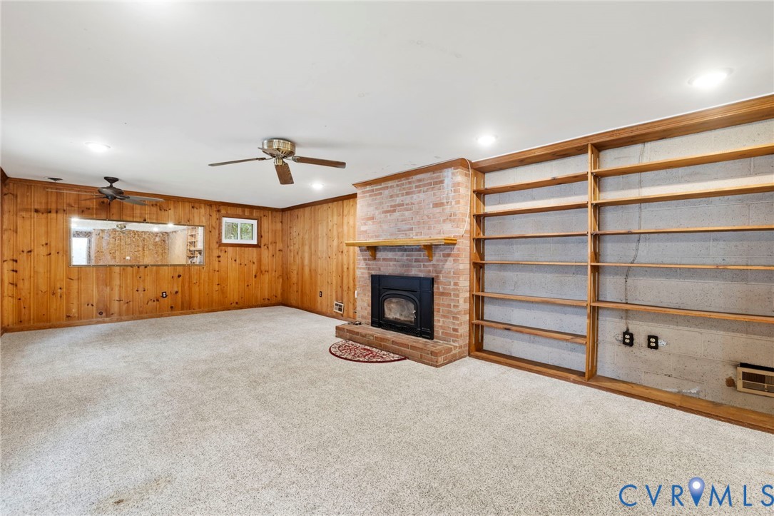11709 Boyd Road Chester, VA 23831 - Photo 21 of 32 a view of an empty room with a fireplace and a window