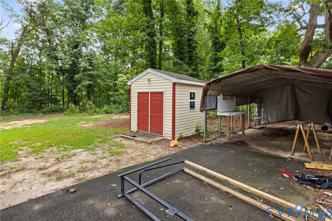 11709 Boyd Road Chester, VA 23831 - Photo 30 of 32 a front view of a house with garden