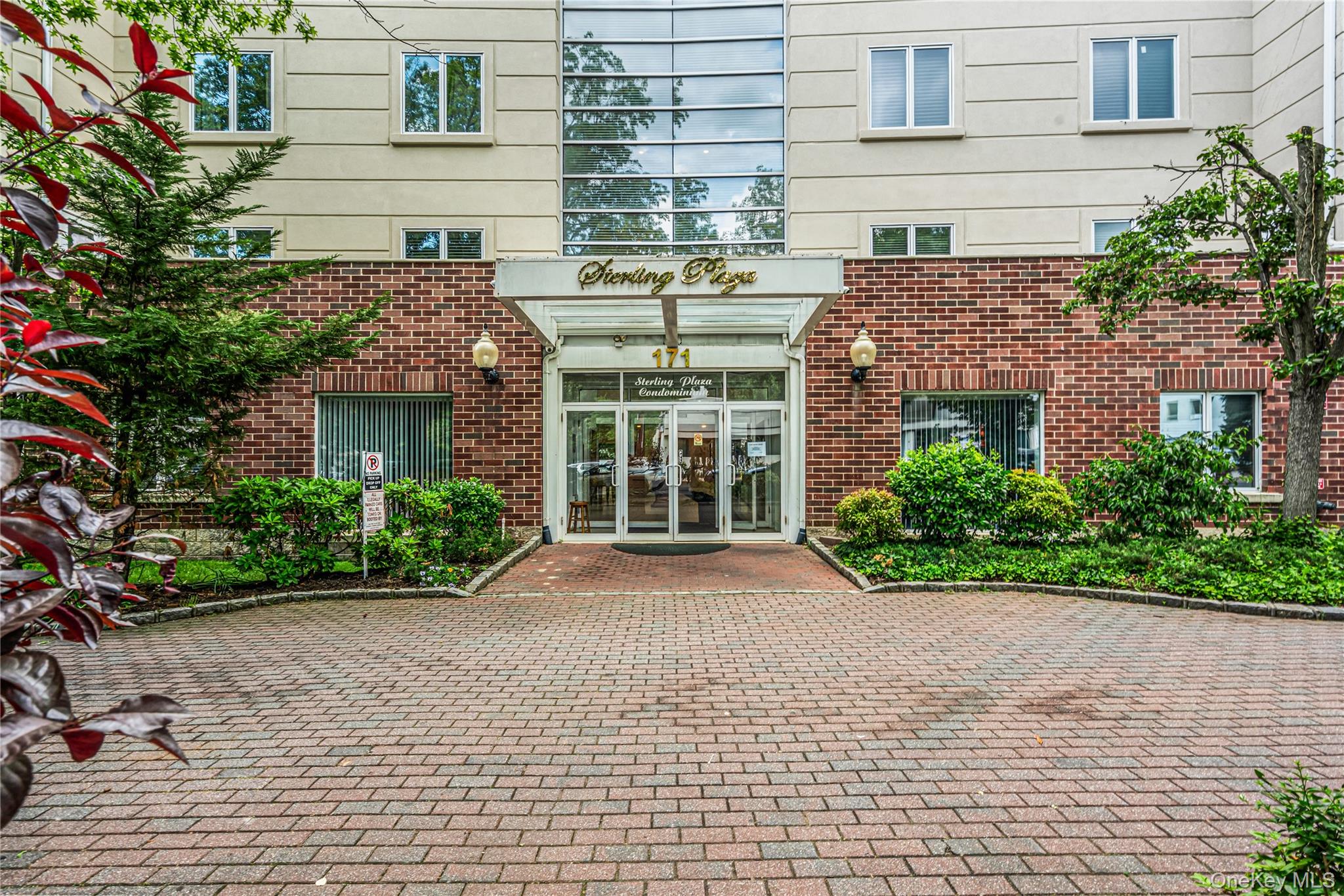 171 Great Neck Road, Unit 4R Great Neck, NY 11021 - Photo 1 of 27 a view of a house with a yard and potted plants