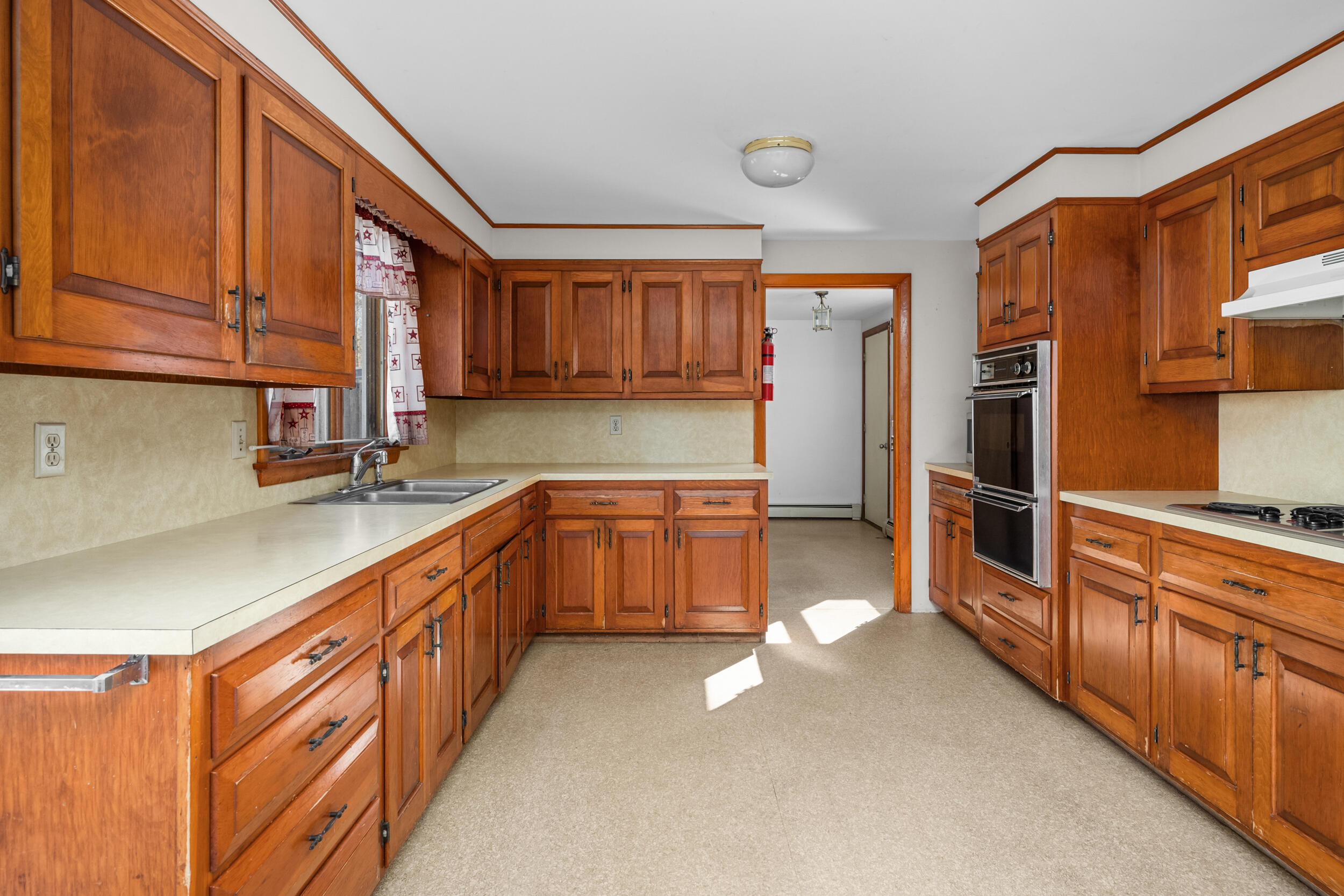 5 Tonset Road Orleans, MA 02653 - Photo 11 of 33 a kitchen with stainless steel appliances a sink and a stove