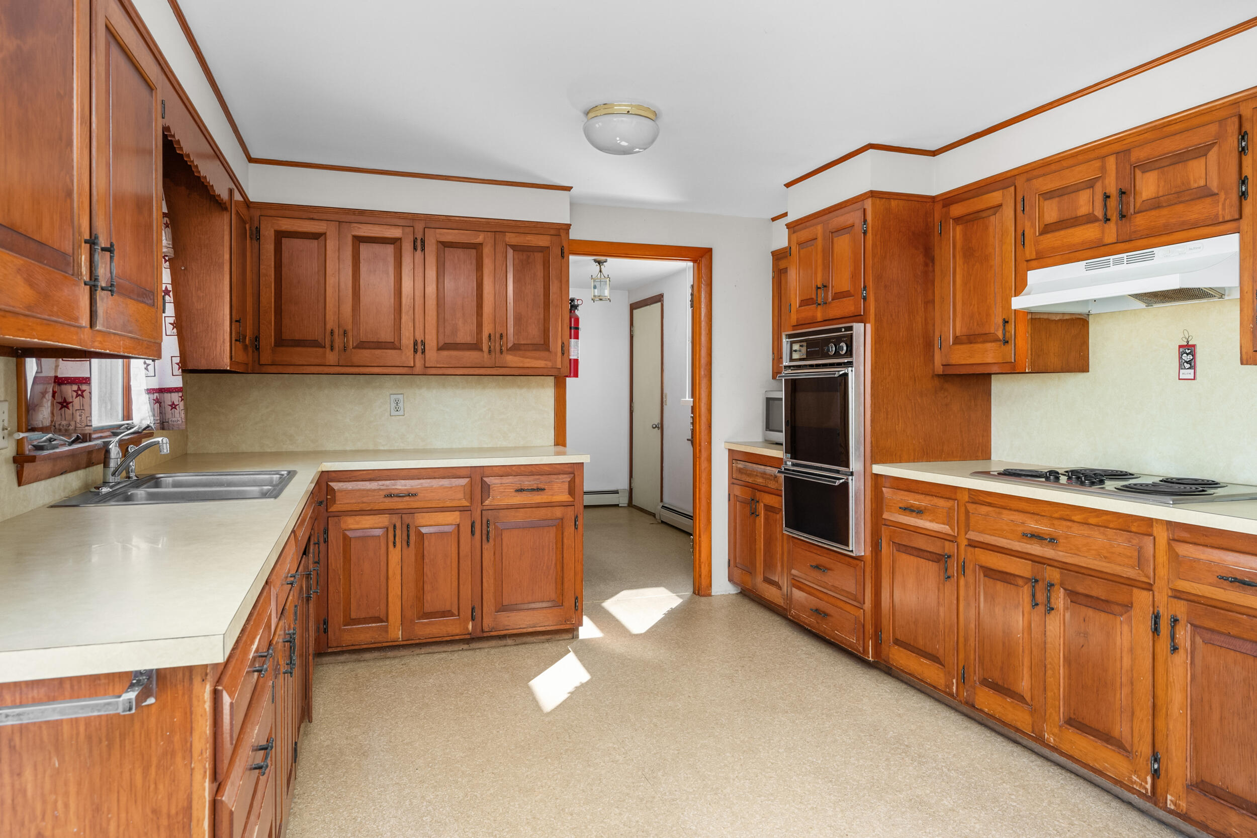 5 Tonset Road Orleans, MA 02653 - Photo 12 of 33 a kitchen with stainless steel appliances granite countertop a refrigerator and a sink