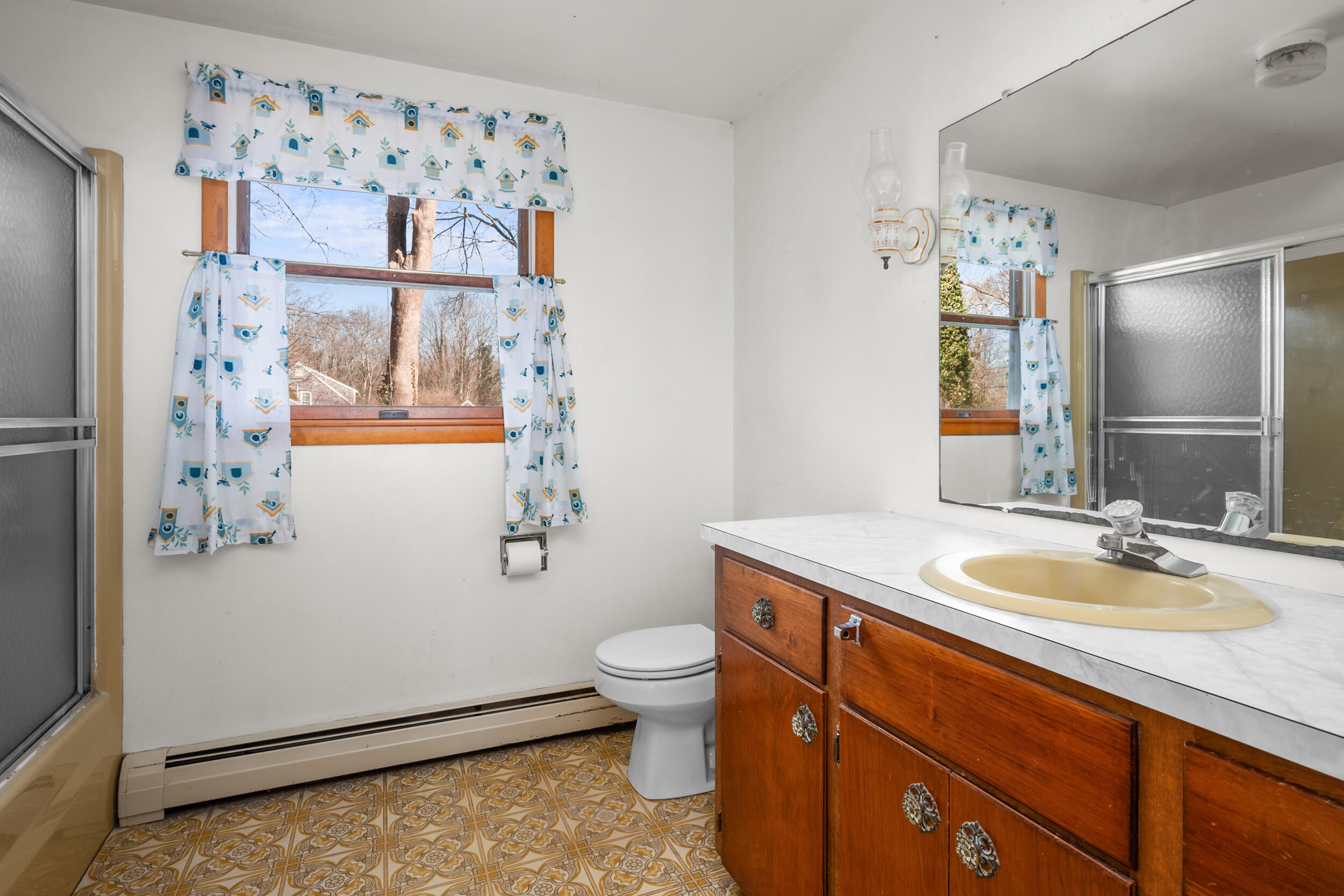 5 Tonset Road Orleans, MA 02653 - Photo 16 of 33 a bathroom with a granite countertop sink toilet and shower