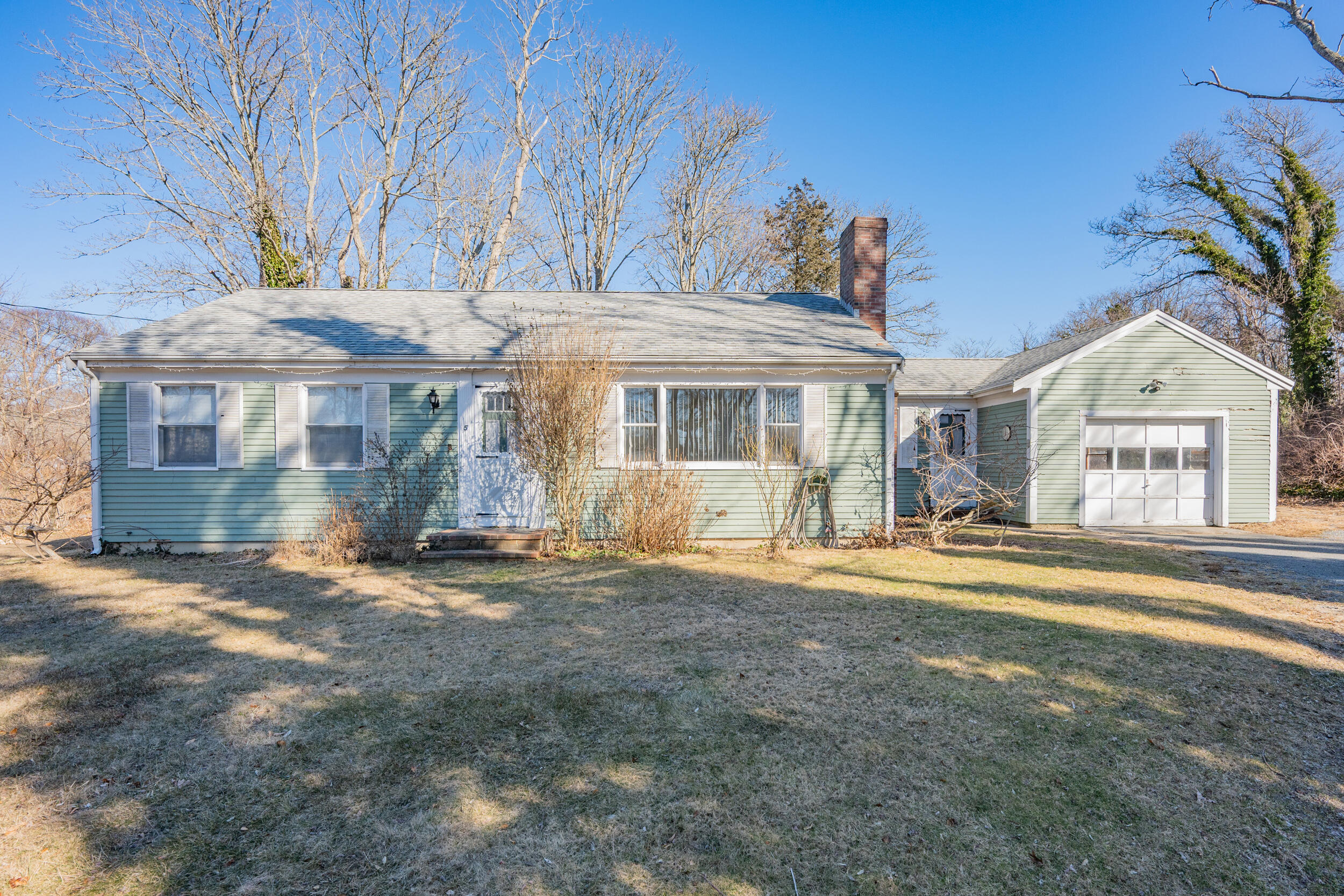 5 Tonset Road Orleans, MA 02653 - Photo 24 of 33 a front view of a house with a garden