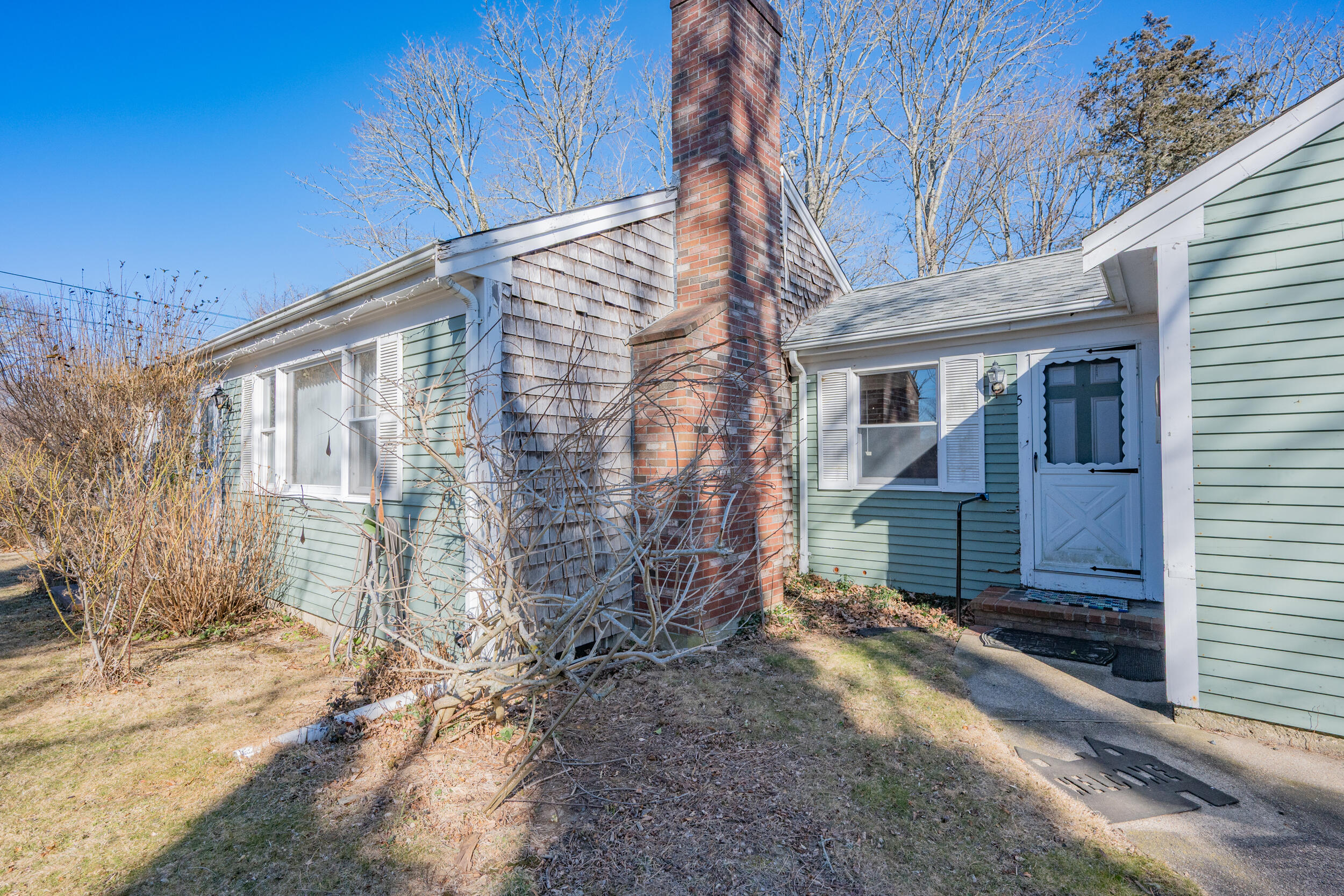 5 Tonset Road Orleans, MA 02653 - Photo 27 of 33 a front view of a house with a yard