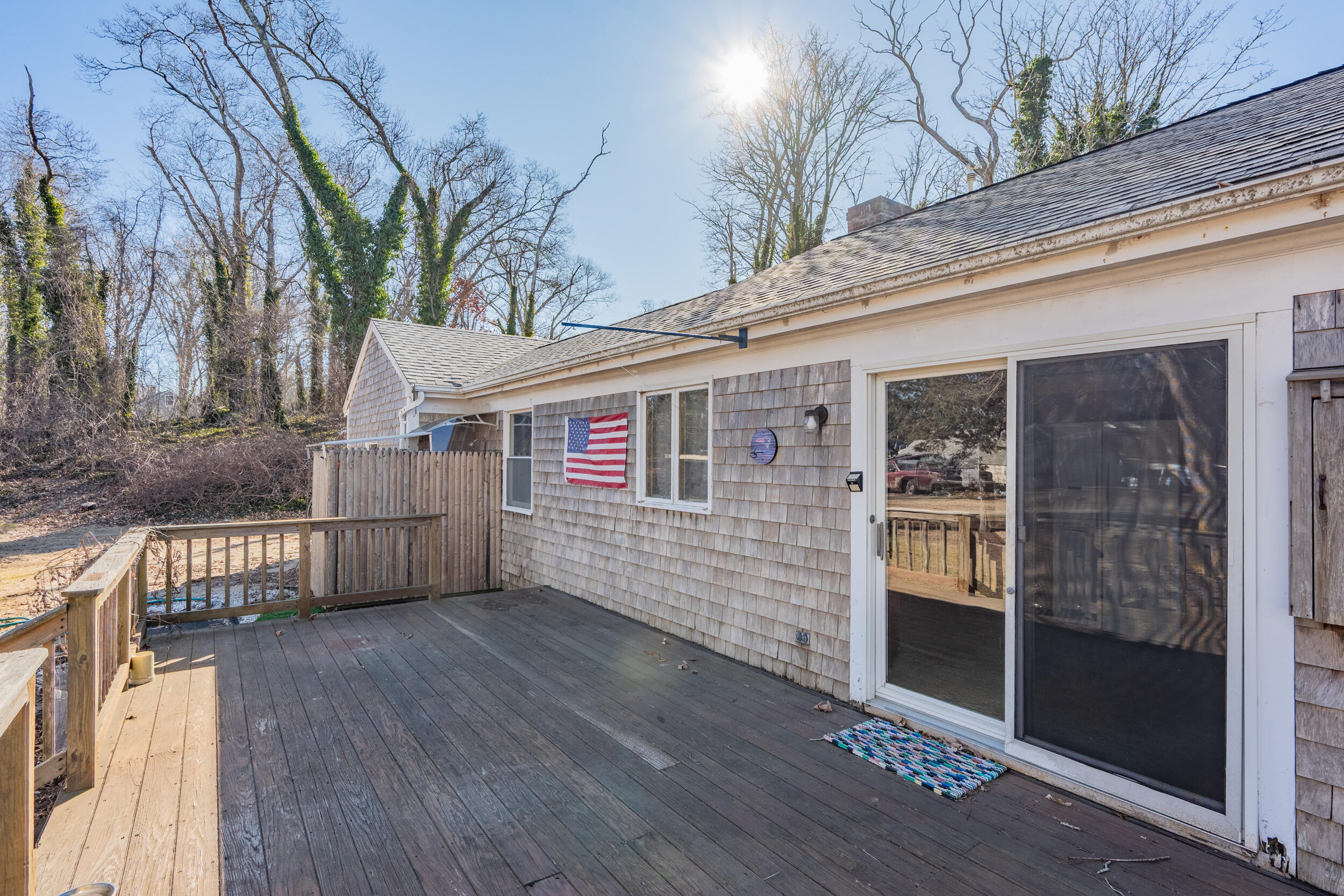 5 Tonset Road Orleans, MA 02653 - Photo 30 of 33 a view of a house with a wooden deck
