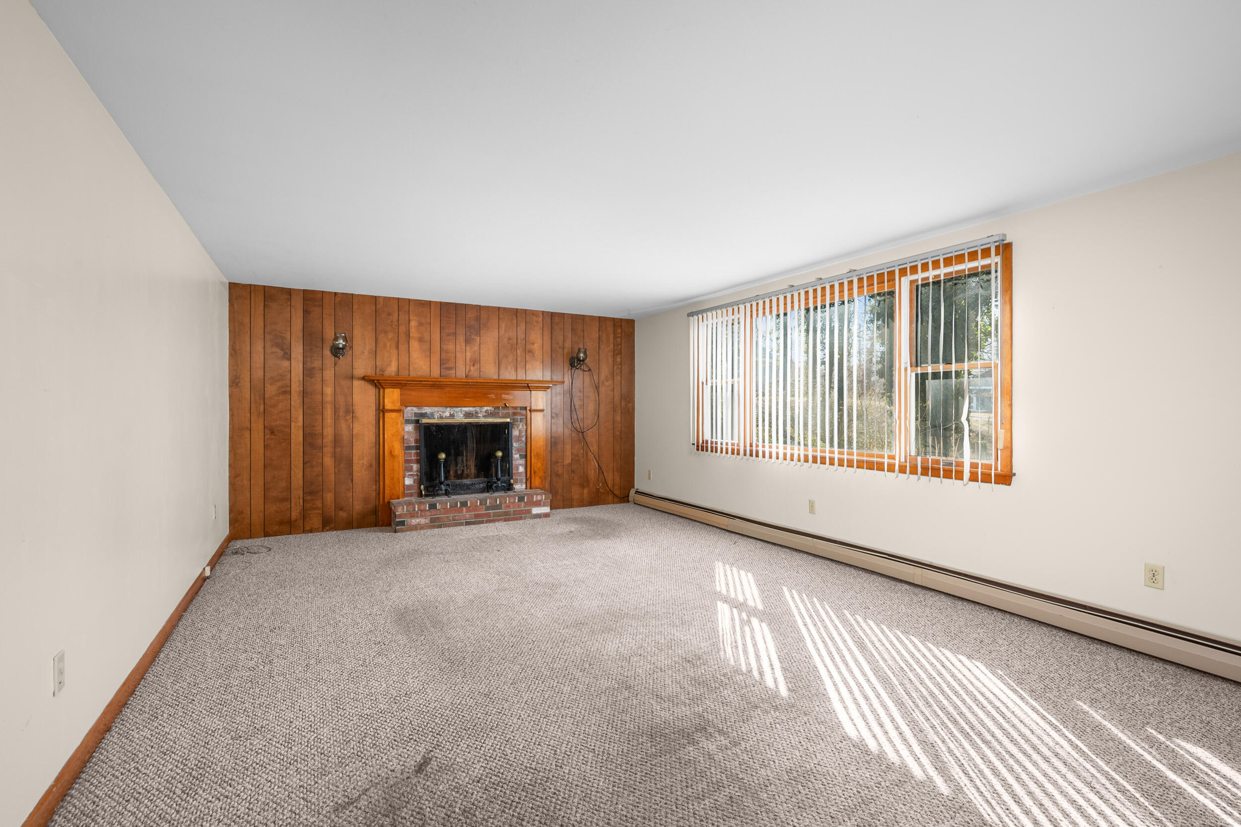5 Tonset Road Orleans, MA 02653 - Photo 6 of 33 an empty room with fireplace