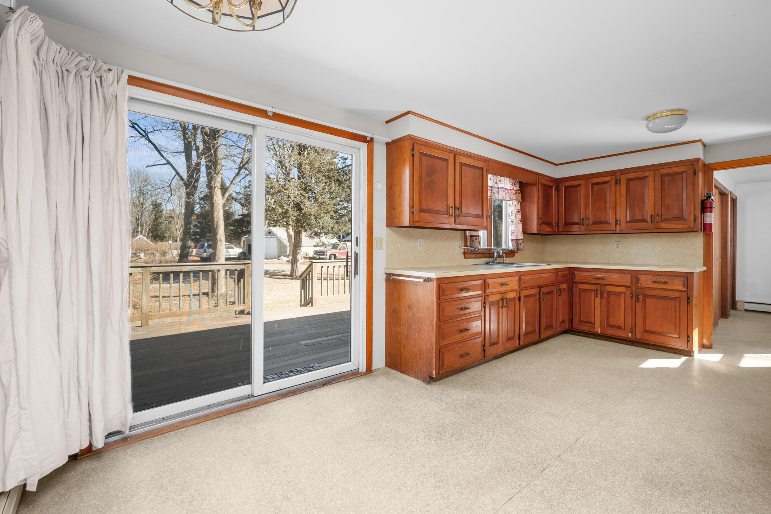 5 Tonset Road Orleans, MA 02653 - Photo 9 of 33 a kitchen with stainless steel appliances a stove and more cabinets