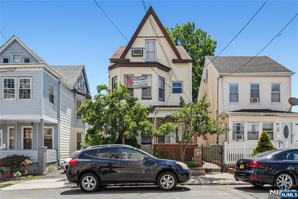 a car parked in front of a house
