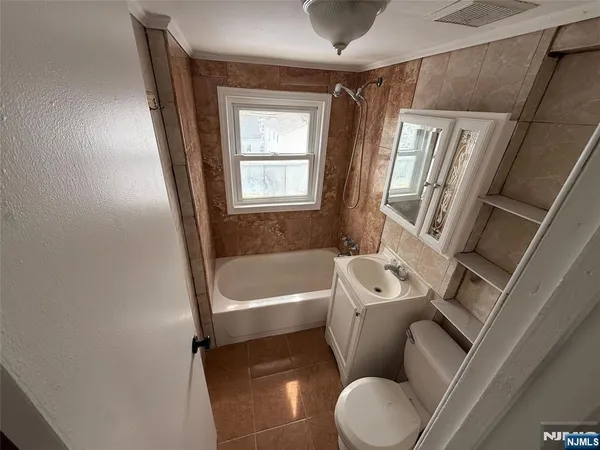 a bathroom with a toilet sink and bathtub