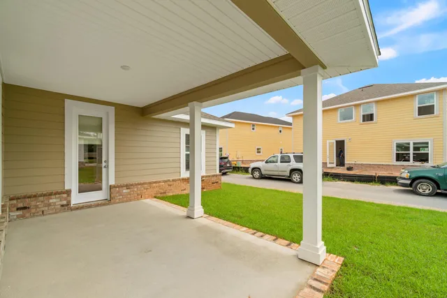 a view of a house with a backyard