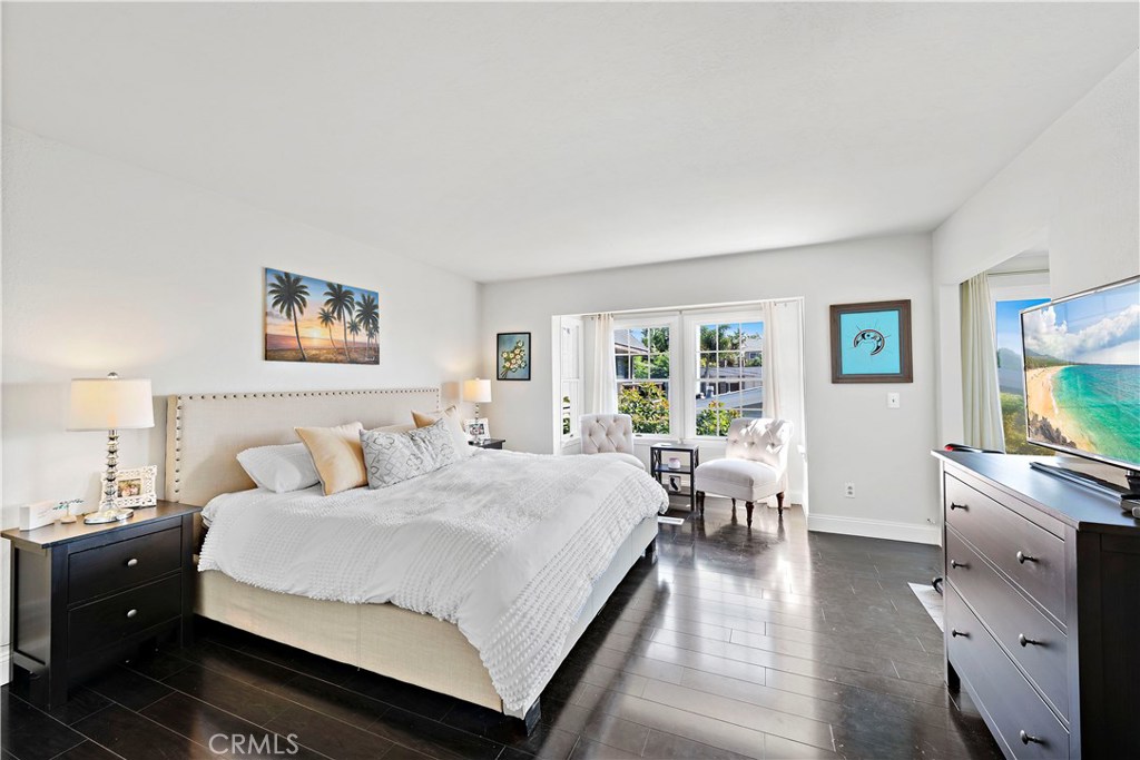 34072 Zarzito Dana Point, CA 92629 - Photo 12 of 44 a spacious bedroom with a bed and a flat screen tv