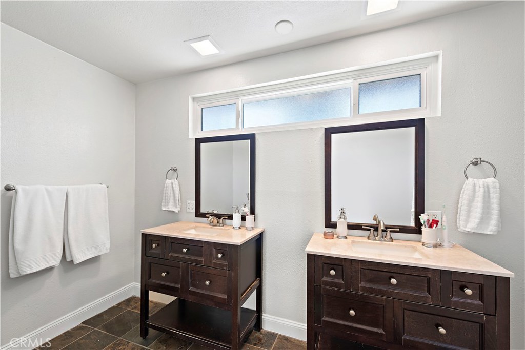 34072 Zarzito Dana Point, CA 92629 - Photo 16 of 44 a bathroom with a double vanity sink and a mirror