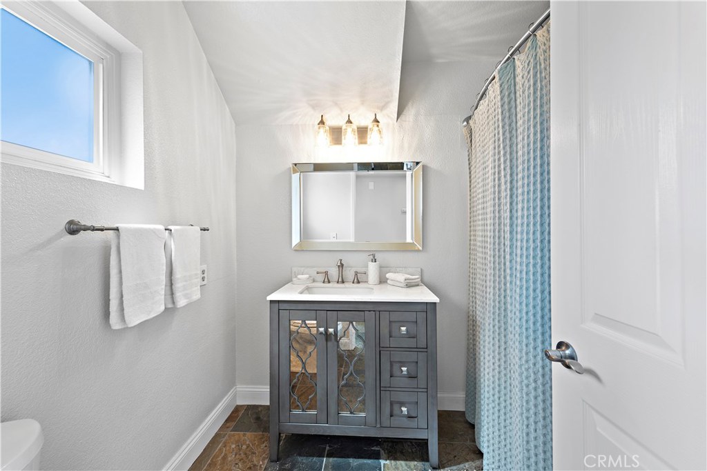 34072 Zarzito Dana Point, CA 92629 - Photo 19 of 44 a bathroom with a sink toilet and shower