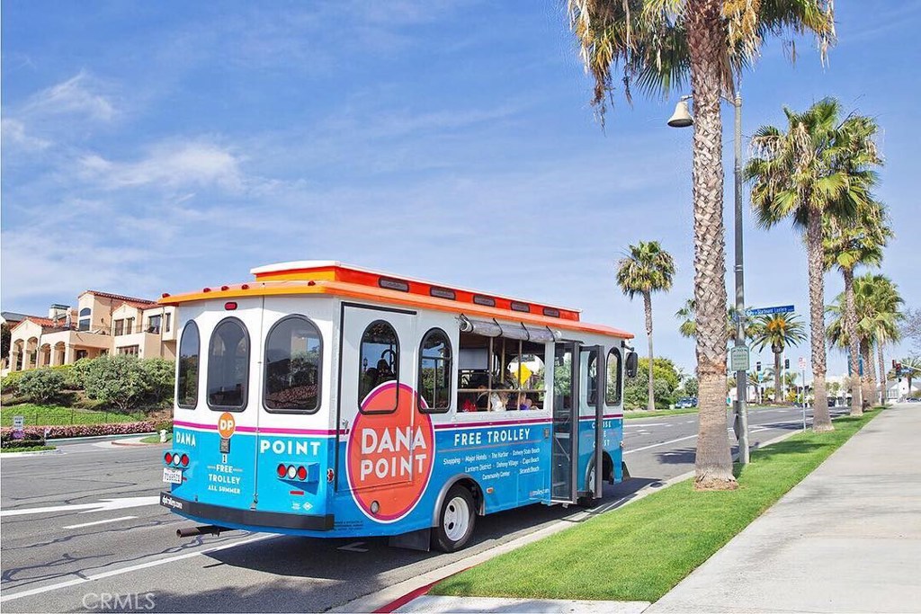34072 Zarzito Dana Point, CA 92629 - Photo 32 of 44 a front view of multi story residential apartment building with garage