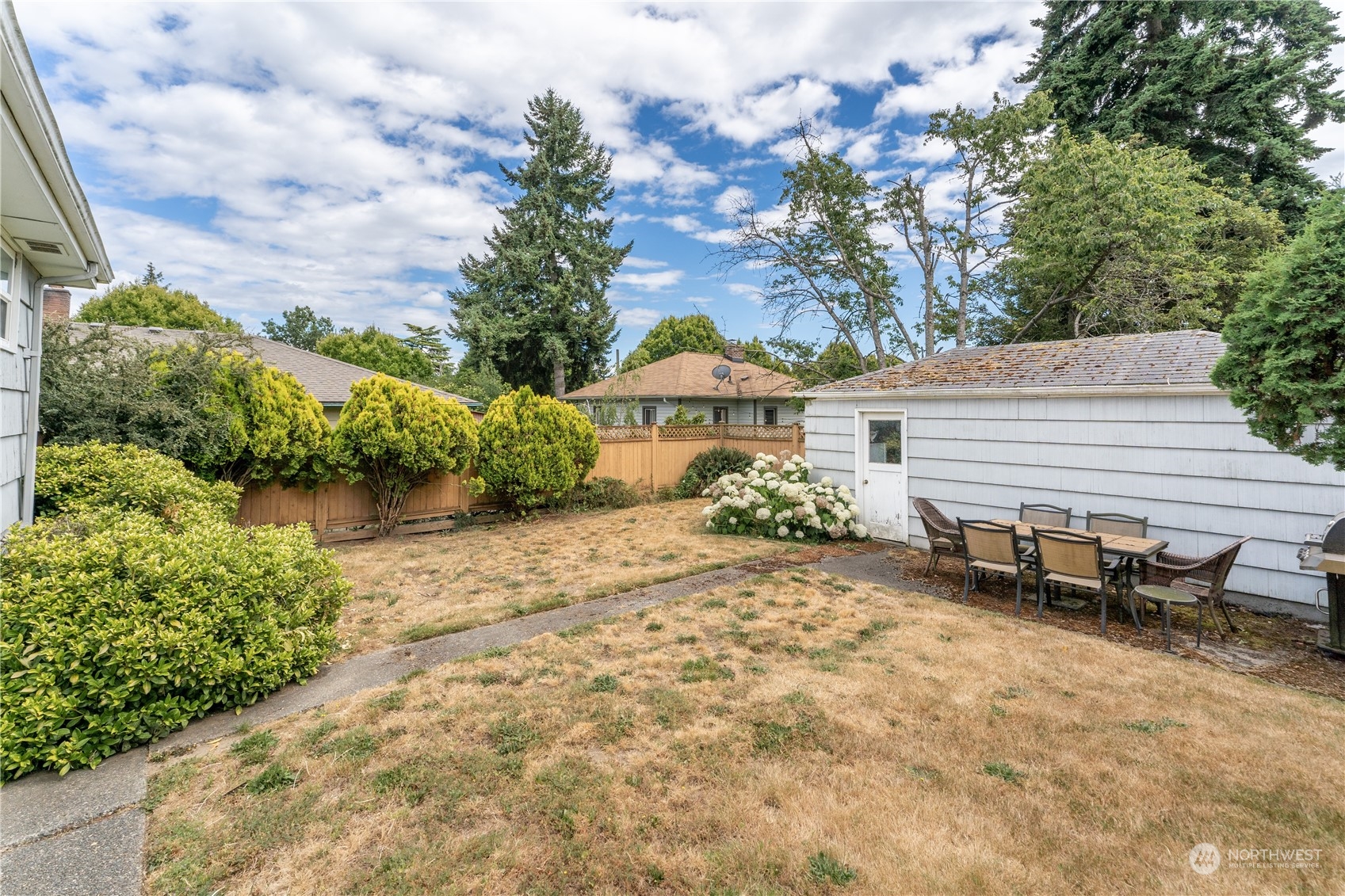 3509 Southwest Trenton Street Seattle, WA 98126 - Photo 19 of 23 a view of a backyard with sitting area