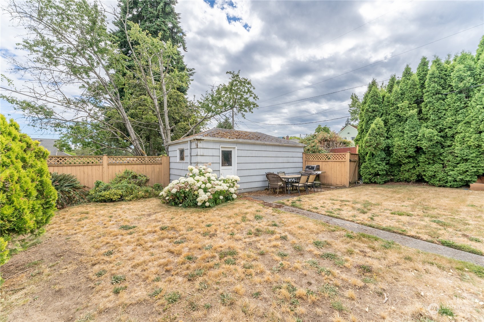 3509 Southwest Trenton Street Seattle, WA 98126 - Photo 21 of 23 a front view of a house with a garden