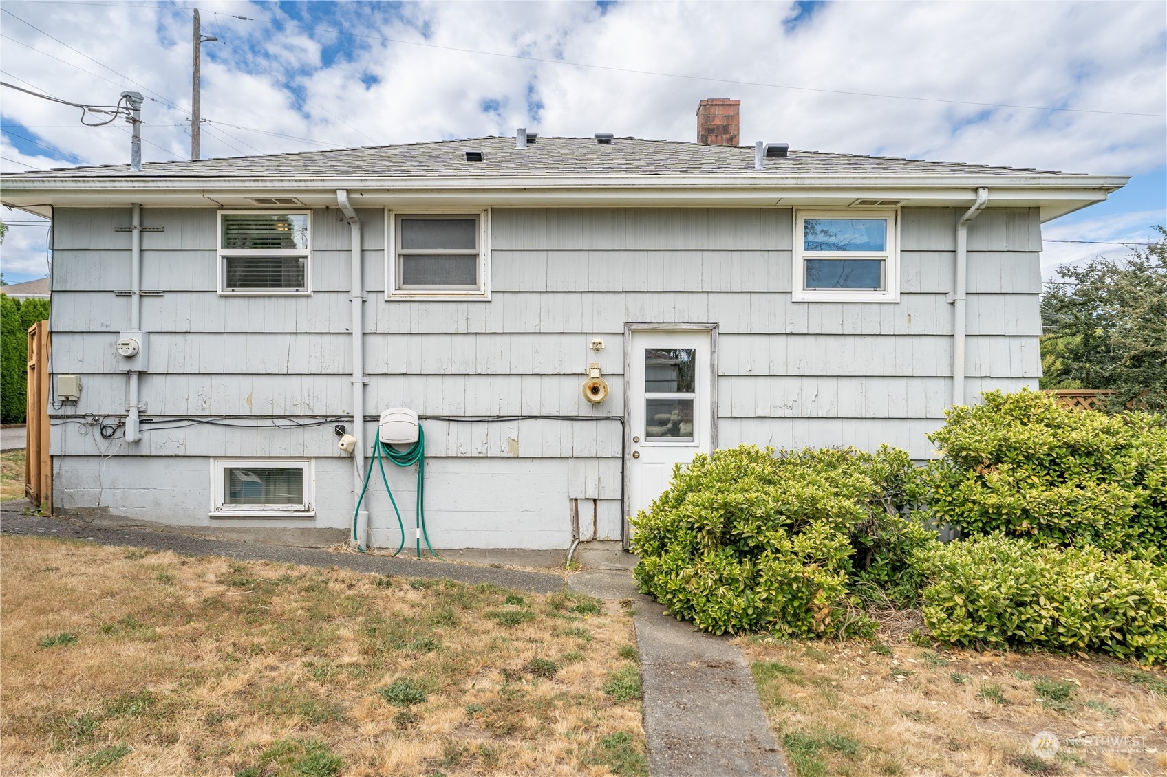 3509 Southwest Trenton Street Seattle, WA 98126 - Photo 22 of 23 a front view of a house with a yard