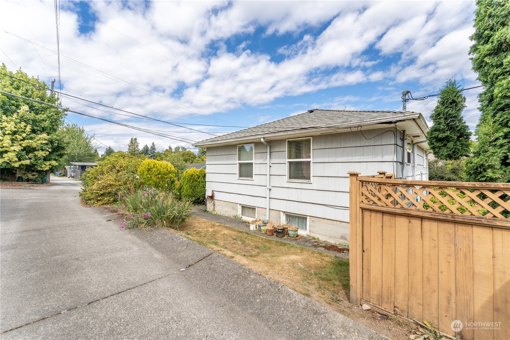 3509 Southwest Trenton Street Seattle, WA 98126 - Photo 23 of 23 a view of a house with a backyard and pathway