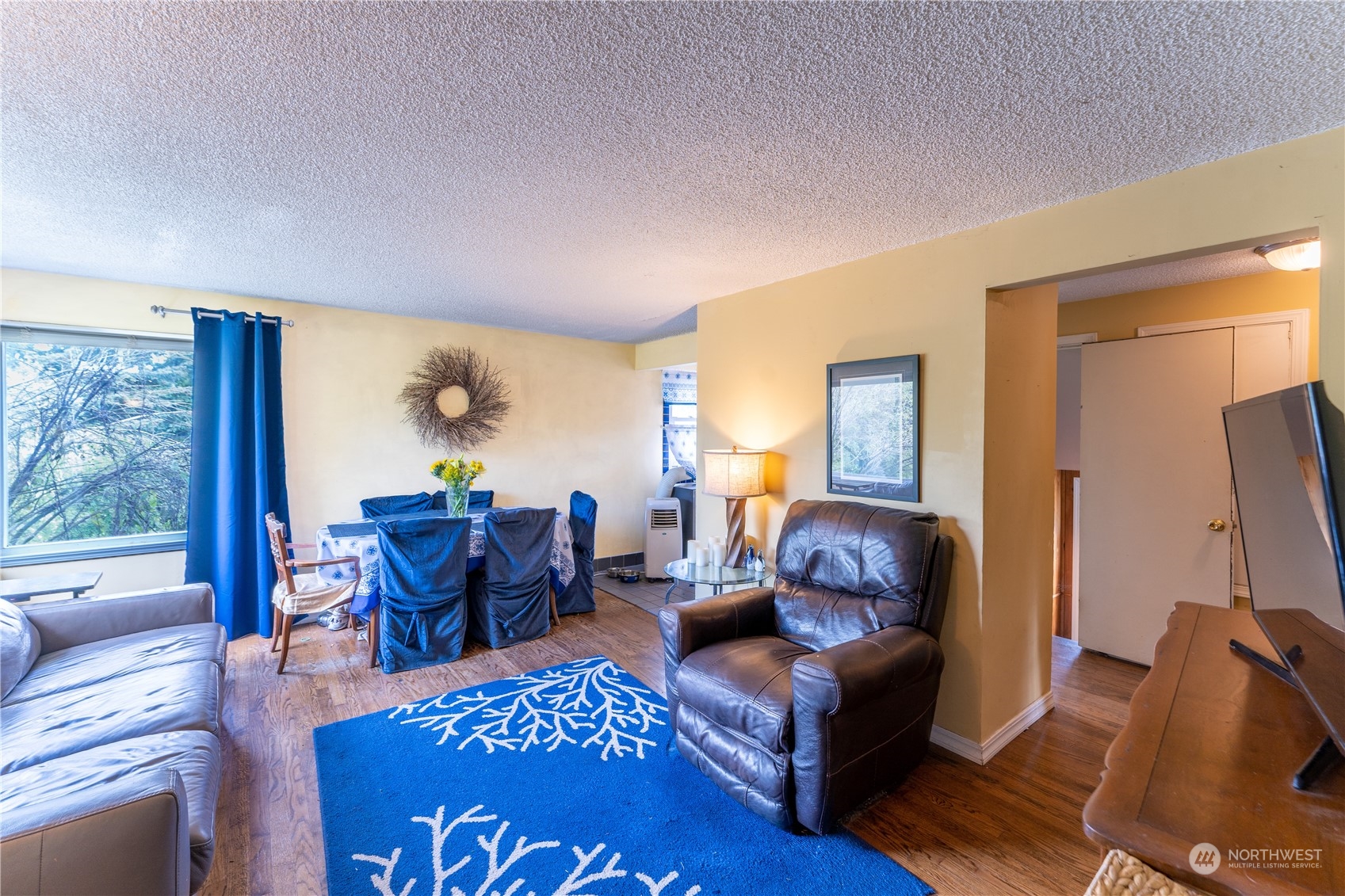 3509 Southwest Trenton Street Seattle, WA 98126 - Photo 5 of 23 a living room with furniture and a flat screen tv