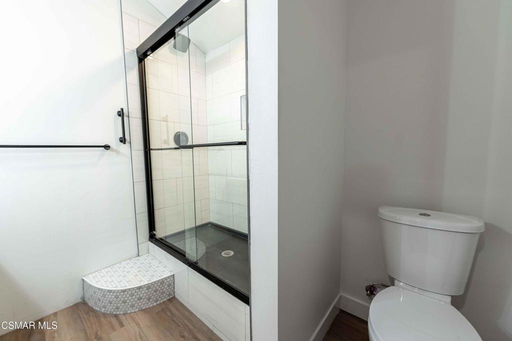 2644 Blue Ridge Circle Simi Valley, CA 93065 - Photo 12 of 15 a bathroom with a granite countertop toilet and a shower