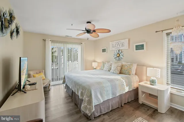 a bed room with a bed and a chandelier