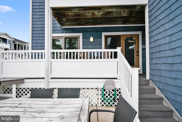 a view of a house with wooden fence