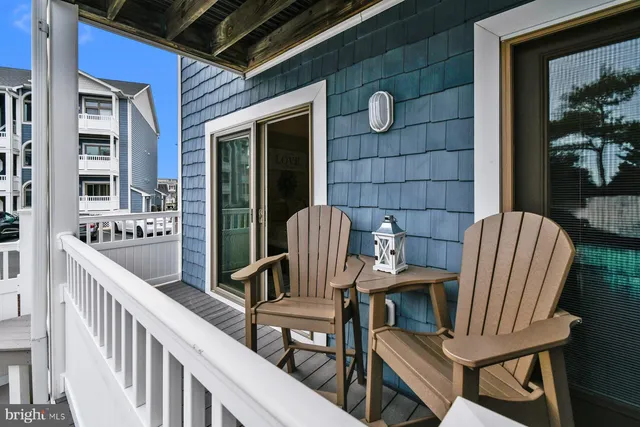 a view of a balcony with chairs
