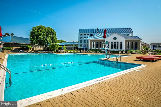 a view of a swimming pool and a yard