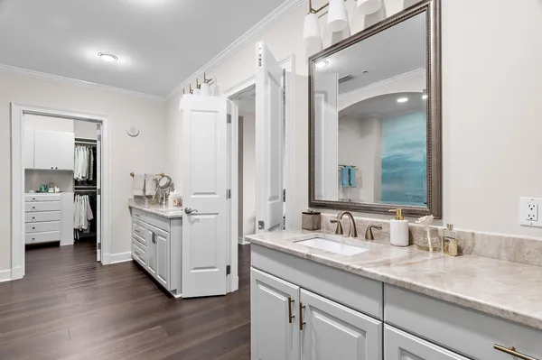 a bathroom with a double vanity sink and mirror