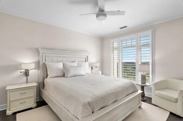 a bedroom with a bed and a couch